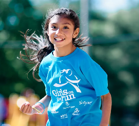 Child running in blue tshirt